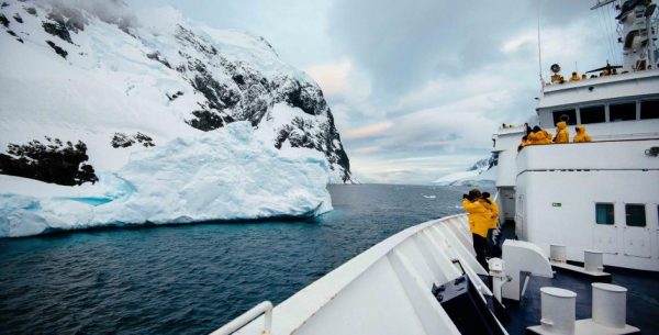 guests taking a photo from the deck of the ocean adventurer in Antarctica